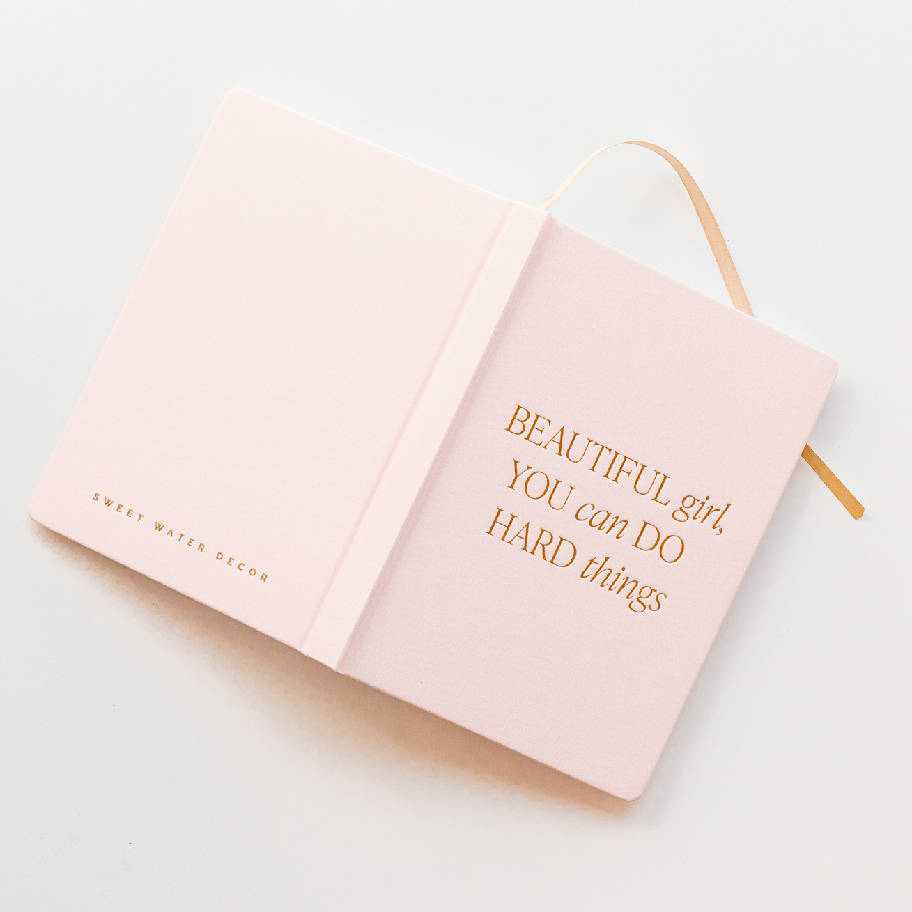 pink notebook with metal foiling
